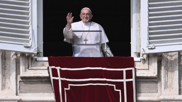 Pope Francis waves from the window of the apostolic palace overlooking St. Peter's square during the weekly Angelus prayer, Oct. 29, 2023, in The Vatican. (Tiziana Fabi/AFP via Getty Images)