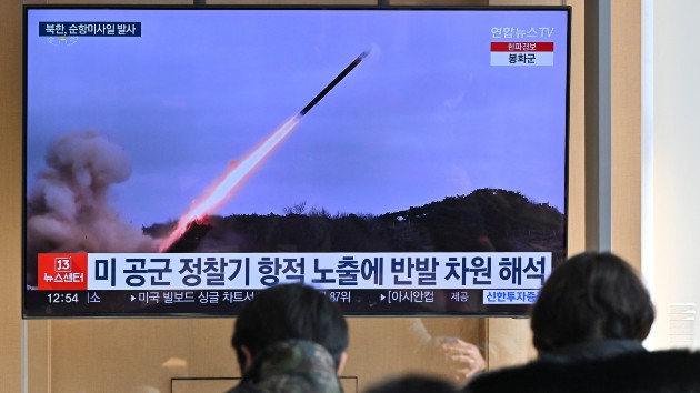 People watch a television screen showing a news broadcast with file footage of a North Korean missile test, at a railway station in Seoul on Jan. 24, 2024. (JUNG YEON-JE/AFP via Getty Images)