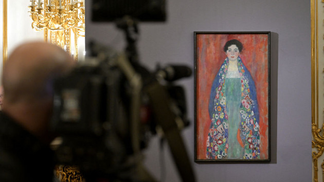 A cameraman takes footage of the painting 'Bildnis Fraeulein Lieser' (Portrait of Miss Lieser) by Austrian artist Gustav Klimt (1862 - 1918) during a press conference of the Kinsky Art Auction House in Vienna, Austria on January 25, 2024. (Photo by ROLAND SCHLAGER/APA/AFP via Getty Images)