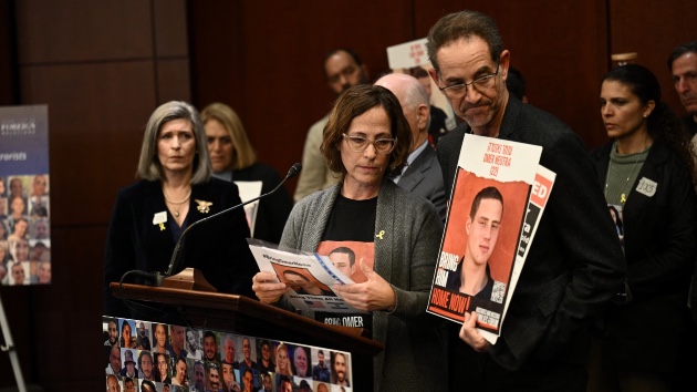 Orna and Ronen Neutra, whose son Omer is held hostage by Hamas in the Gaza Strip, hold pictures of him during a bipartisan press conference by lawmakers on Capitol Hill, Jan. 17, 2024, in Washington. (Brendan Smialowski/AFP via Getty Images)