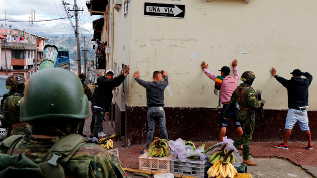 Members of the Armed Forces frisk men during an operation to protect civil security in Quito, on Jan. 10, 2024. (Stringer/AFP via Getty Images)