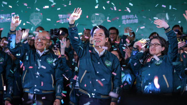 Confetti flies over the stage and crowd as Taiwan's Vice President and presidential-elect from the Democratic Progressive Party Lai Ching-te, center, and his running mate Hsiao Bi-khim speak to supporters at a rally at the party's headquarters on Jan. 13, 2024 in Taipei, Taiwan. (Annabelle Chih/Getty Images)