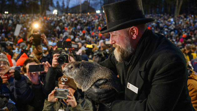 Groundhog handler AJ Dereume holds Punxsutawney Phil after he did not see his shadow predicting an early Spring during the 138th annual Groundhog Day festivities on Friday February 2, 2024 in Punxsutawney, Pennsylvania. (Photo by Jeff Swensen/Getty Images)