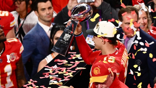 Kansas City Chiefs' quarterback #15 Patrick Mahomes holds the trophy after winning Super Bowl LVIII against the San Francisco 49ers at Allegiant Stadium in Las Vegas, Nevada, February 11, 2024. (Photo by PATRICK T. FALLON/AFP via Getty Images)