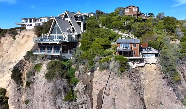 Officials are concerned about three homes on Scenic Drive in Dana Point, Calif., that are teetering on the edge of a cliff following multiple rounds of severe storms. CREDIT: KABC