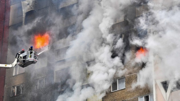 Ukrainian rescuers extinguish a fire in a residential building following a missile attack in Kyiv on Feb. 7, 2024, amid the Russian invasion of Ukraine. (Sergei Supinsky/AFP via Getty Images)