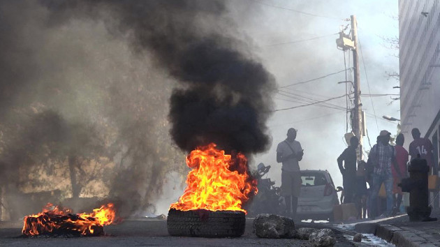 This screen grab taken from AFPTV shows tires on fire near the main prison of Port-au-Prince, Haiti, on March 3, 2024, after a breakout by several thousand inmates. (LUCKENSON JEAN/AFPTV/AFP via Getty Images)