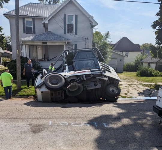 Sinkhole Partially Swallows Kewanee Street Sweeper on North Elm Street