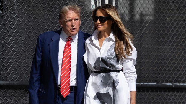Former U.S. President Donald Trump and former first lady Melania Trump walk together as they prepare to vote at a polling station setup in the Morton and Barbara Mandel Recreation Center, Mar. 19, 2024, in Palm Beach, Fla. (Joe Raedle/Getty Images)