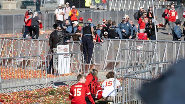 People crouch after shots rang out near Union Station after the Kansas City Chiefs Super Bowl LVIII championship rally, Feb. 14, 2024, at Union Station in Kansas City. (Tammy Ljungblad/Kansas City Star/TNS via Getty Images)
