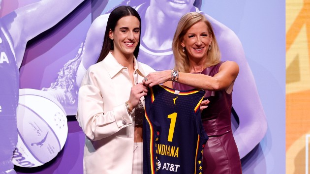 Caitlin Clark poses with WNBA Commissioner Cathy Engelbert after being selected first overall pick by the Indiana Fever during the 2024 WNBA Draft at Brooklyn Academy of Music on April 15, 2024 in New York City. (Sarah Stier/Getty Images)