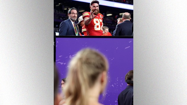 Travis Kelce waves to Taylor Swift; Ezra Shaw/Getty Images