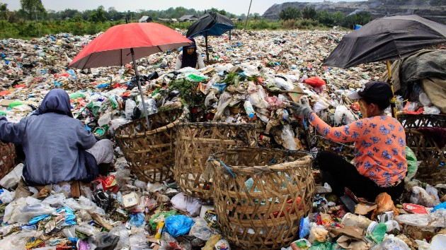 Scavengers collect plastic waste to sell to a recycling centre at a landfill in Medan, North Sumatra, March 27, 2024. (Kartik Byma/AFP via Getty Images)