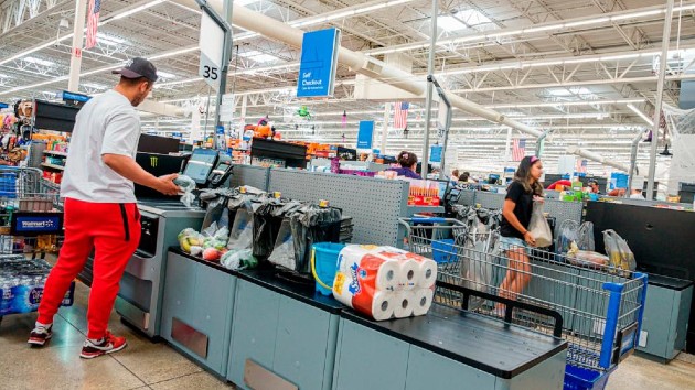 Self-service checkout customer scanning and paying in a Walmart Supercenter in Miami, Florida. (Jeffrey Greenberg/Getty Images)