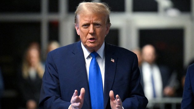 Former president Donald Trump speaks to the press during his trial at Manhattan Criminal Court in New York City, Apr. 22, 2024. (Angela Weiss/POOL/AFP via Getty Images)