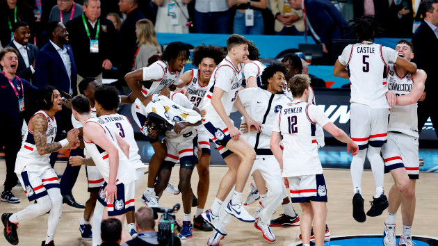 The Connecticut Huskies celebrate after beating the Purdue Boilermakers 75-60 to win the NCAA Men's Basketball Tournament National Championship game at State Farm Stadium on April 08, 2024 in Glendale, Arizona. (Chris Coduto/Getty Images)
