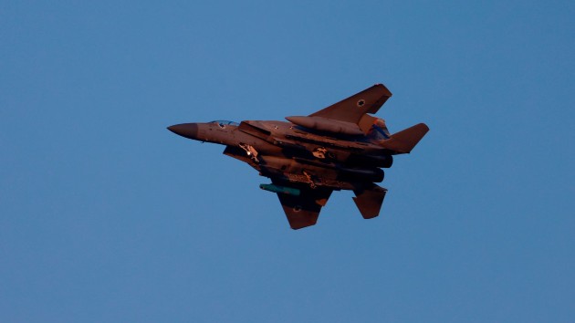 An Israeli army F-15 fighter jet flies over central Israel on April 15, 2024. (Menahem Kahana/AFP via Getty Images)