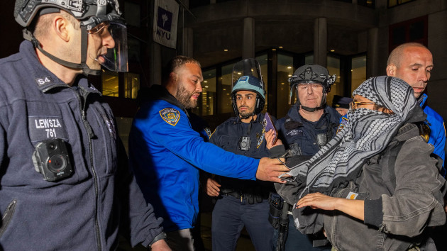 NYPD officers detain pro-Palestinian students and protesters who had set up an encampment on the campus of New York University to protest the Israel-Hamas war, in New York on April 22, 2024. (Alex Kent/AFP via Getty Images)