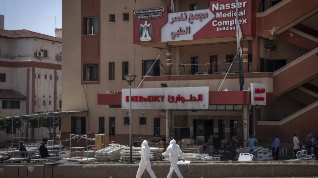 Medics walk in front of the emergency ward at Nasser Hospital where bodies were discovered, in Khan Yunis in the southern Gaza Strip on April 23, 2024. (AFP via Getty Images)