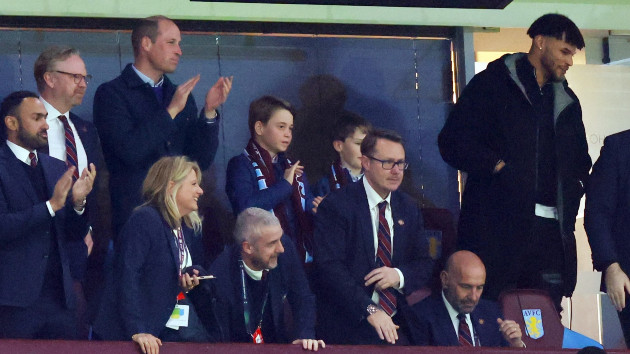 Prince William, Prince of Wales and Prince George of Wales look on alongside Tyrone Mings of Aston Villa during the UEFA Europa Conference League 2023/24 Quarter-final first leg match between Aston Villa and Lille OSC at Villa Park on April 11, 2024 in Birmingham, England. -- Marc Atkins/Getty Images