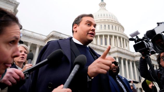 Rep. George Santos is surrounded by journalists as he leaves the Capitol after his fellow members of Congress voted to expel him from the House of Representatives, Dec. 1, 2023. (Drew Angerer/Getty Images)