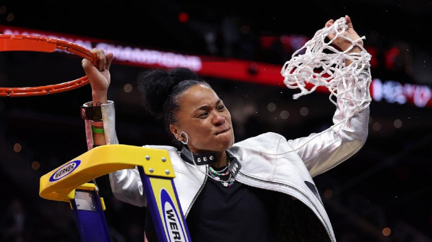 Head coach Dawn Staley of the South Carolina Gamecocks cuts down the net after beating the Iowa Hawkeyes in the 2024 NCAA Women's Basketball Tournament National Championship at Rocket Mortgage FieldHouse on April 7, 2024 in Cleveland. -- Gregory Shamus/Getty Images