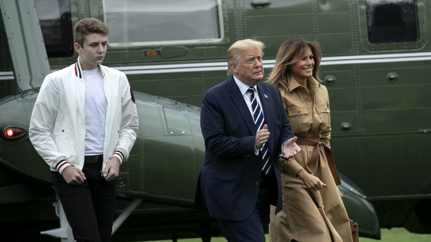 U.S. President Donald Trump, center, son Barron Trump, left, and First Lady Melania Trump walk on the South Lawn of the White House after exiting Marine One in Washington, D.C., U.S., on Sunday, Aug. 16, 2020. (Stefani Reynolds/Bloomberg via Getty Images)