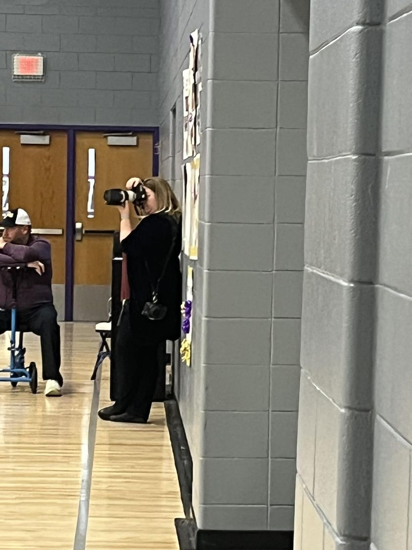 Folks, it’s a Tuesday night, she does not have a daughter playing, but she’s in Farmington taking pictures at the Volley…