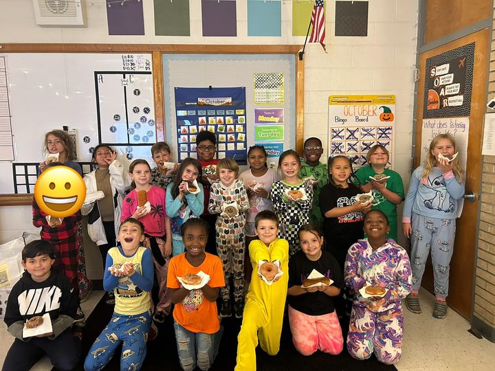 Today Miss. Coker’s class celebrated covering their October Bingo Board by having a pajama day and eating donuts from Hy…