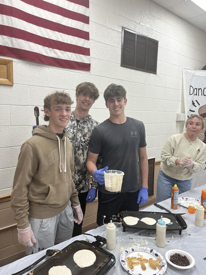 Bomber Football players Hayden Katz, Kyler Norton, and Kaden Knupp volunteered at the WIU Rocky DanceAThon Pancake fundr…