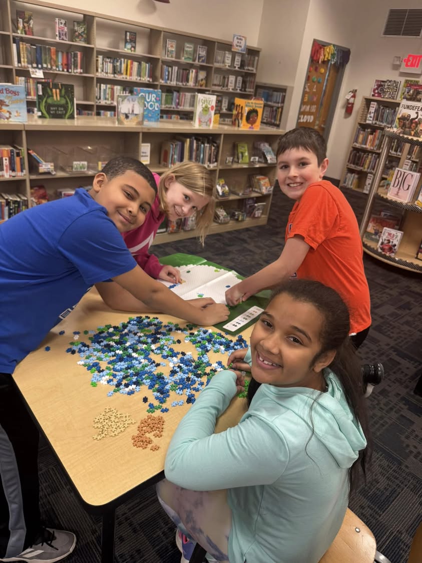Mrs. Brookman got the kids a new puzzle for the Library. They love it!! #library #MAC185 #edison