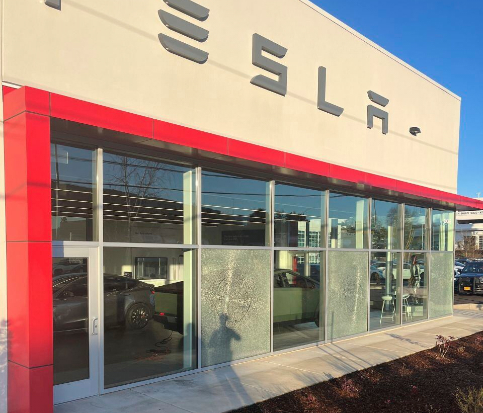 Oregon police investigate nighttime gunshots that shattered windows at Tesla dealership