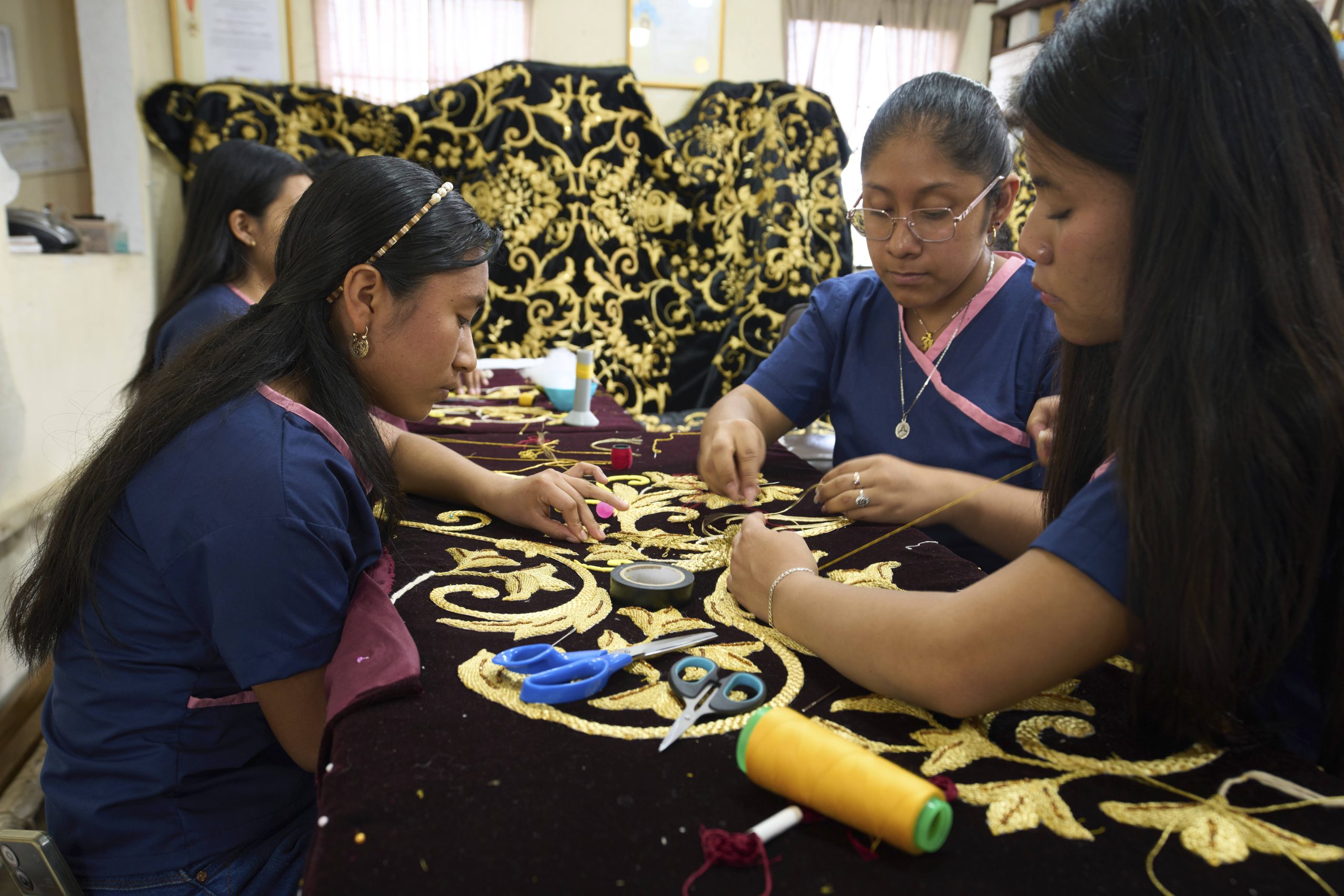 Artisans in Guatemala hand-stitch velvet cloaks for Holy Week processions