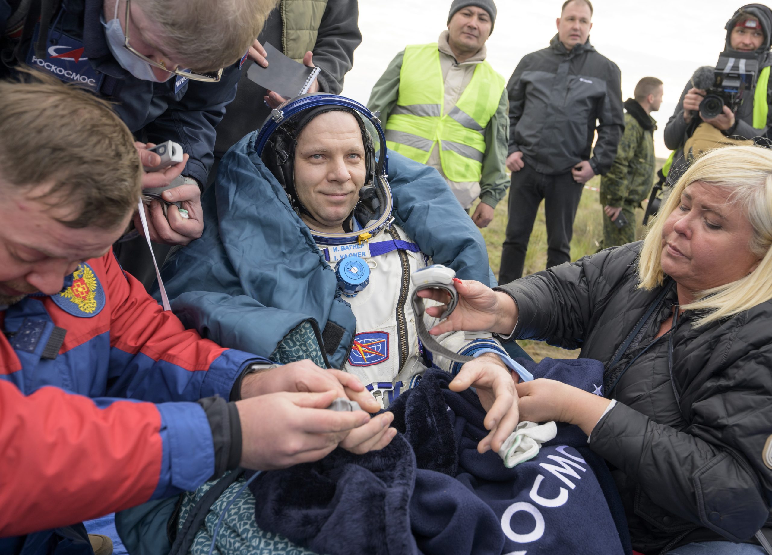 A Soyuz capsule with 2 Russians and 1 American returns to Earth from the International Space Station