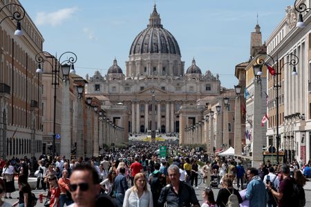 Easter pilgrims in sun-drenched St Peter’s Square stunned by pope’s death
