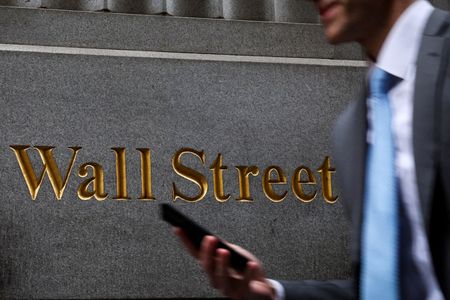 Wall Street ends higher on earnings, hopes of easing tariff tensions