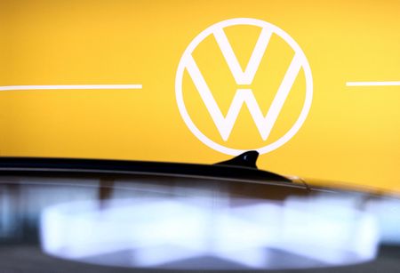 Volkswagen says trade tensions, EV costs to weigh on profits