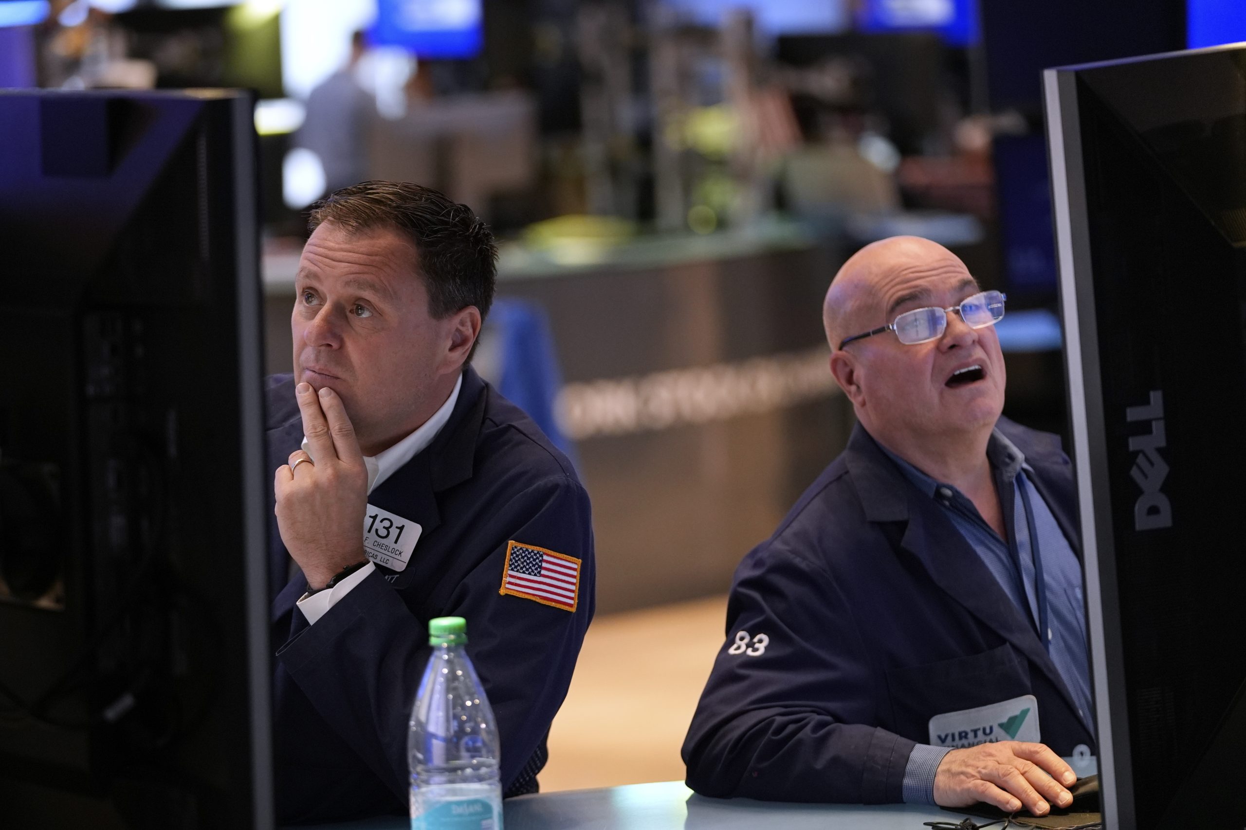 AP PHOTOS: US stocks sink after a weak report on the economy