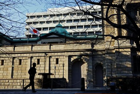 BOJ keeps rates steady, cuts growth forecasts