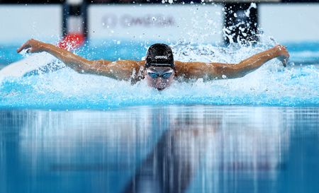 Swimming-American Walsh breaks own 100m butterfly world record