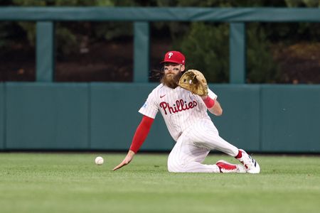 Phillies rally from four-run deficit to repel Rays in extras