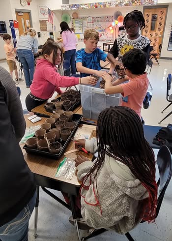 Scientists from Corteva came to Mrs. Ruebushs fourth-grade classroom, and we all helped to plant the seed starters for…