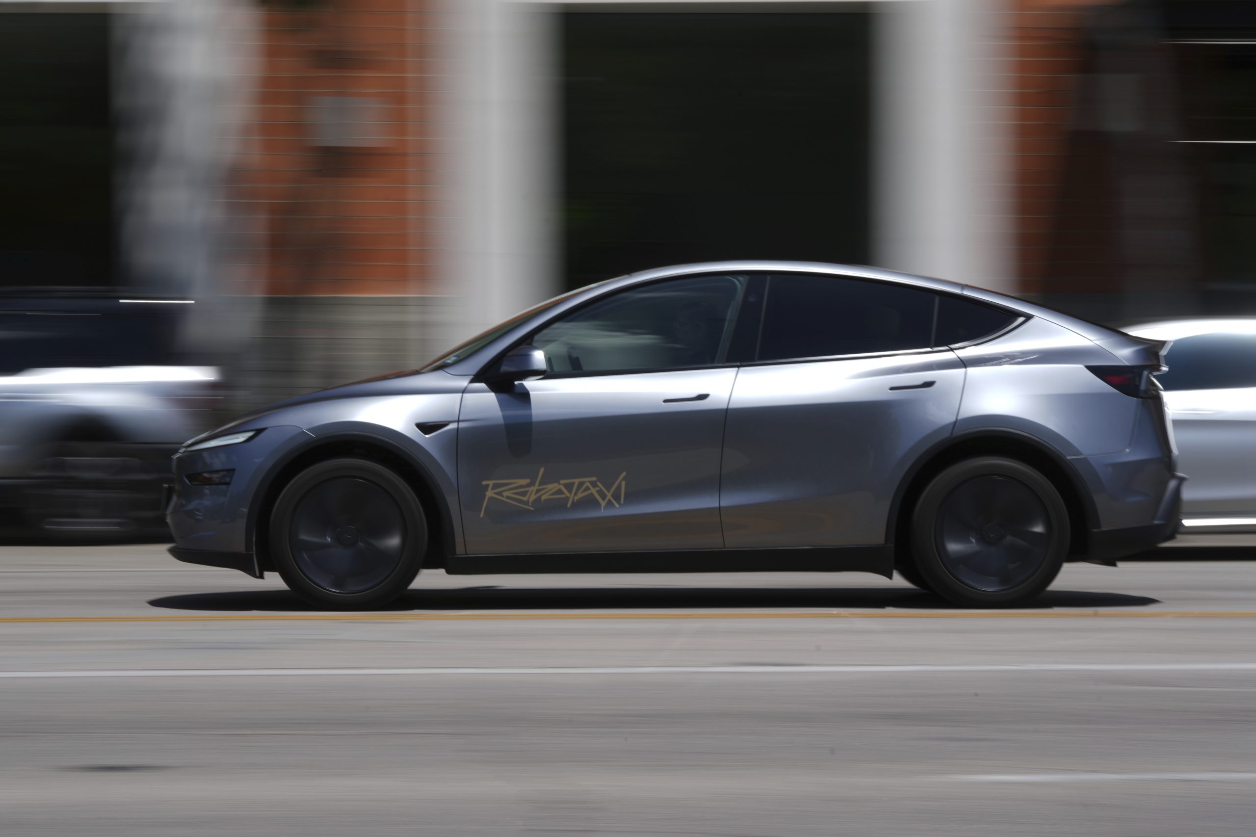 Musk’s ‘robotaxis’ draw regulatory scrutiny after video shows one driving in an opposing lane