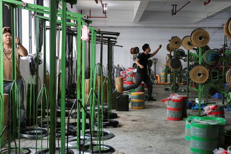 China’s factory activity expected to shrink for third month amid trade tensions: Reuters poll