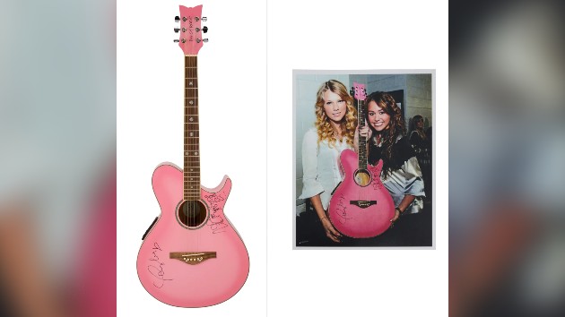 Guitar signed by Taylor Swift and Miley Cyrus sells for $104K at auction