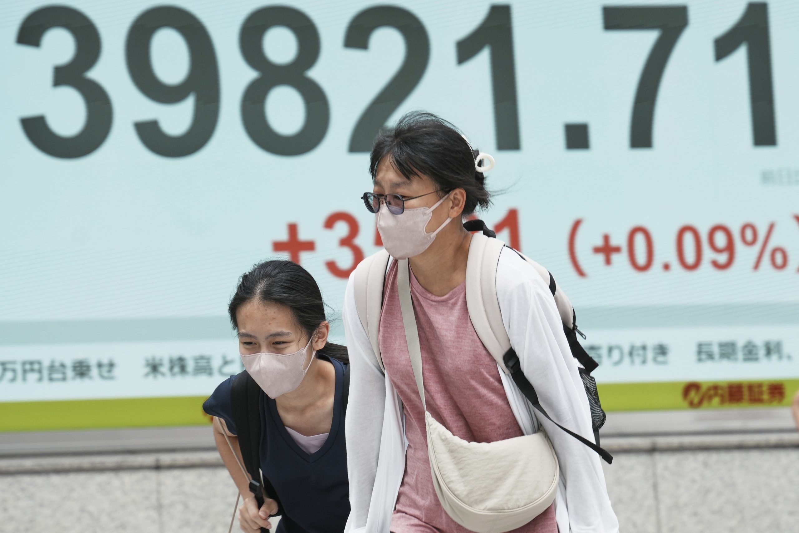 Asian shares are mixed as Trump’s tariff deadline looms, while US stocks set records