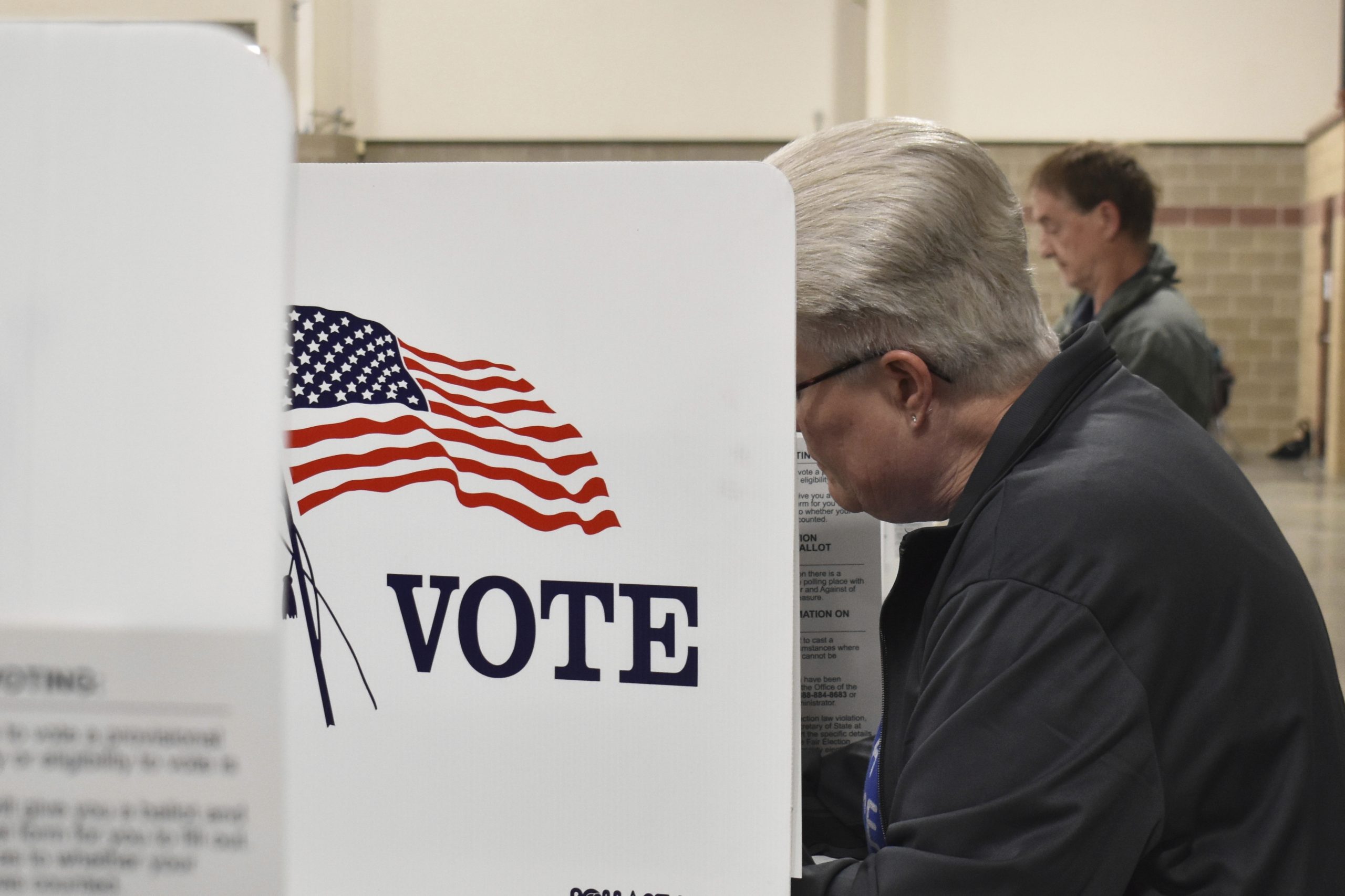 Judge limits a small part of a court order blocking Trump’s election overhaul as lawsuits continue