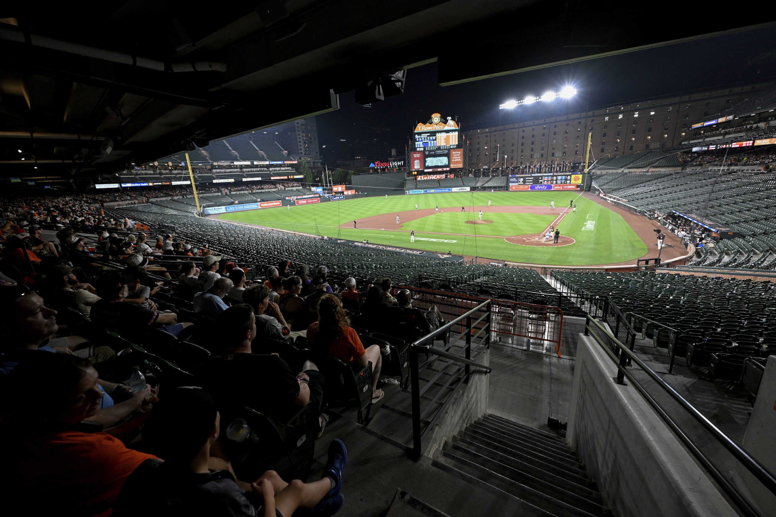 Why did the Orioles and Rockies keep playing after fans evacuated seats?