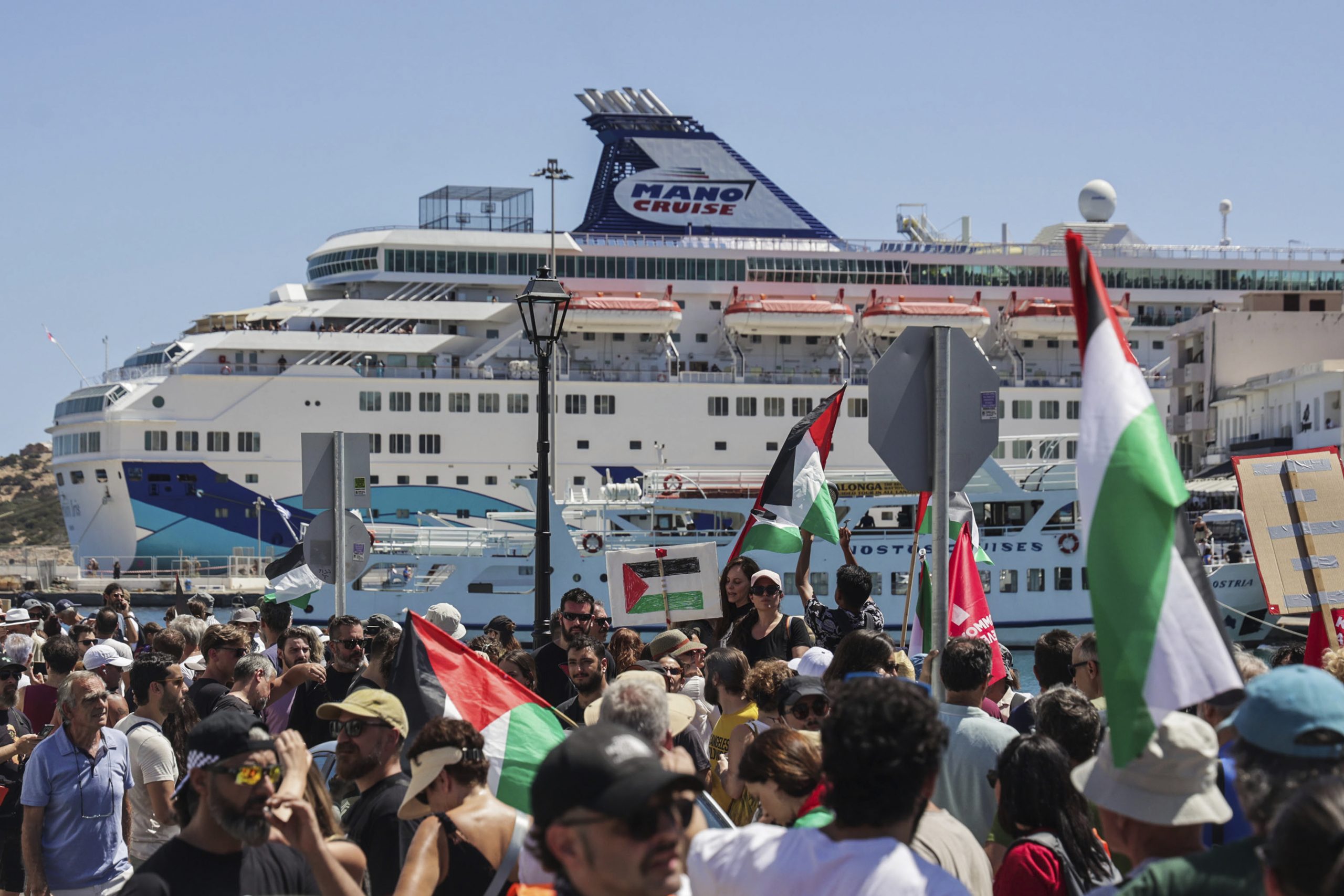 Anti-war demonstrators protest the arrival of an Israeli cruise ship on the Greek island of Crete