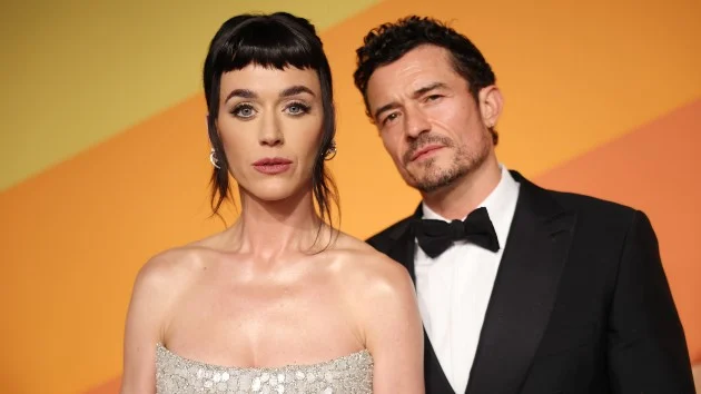 Katy Perry and Orlando Bloom pose for family photo on vacation